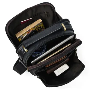 Detailed view of men's leather messenger bag showcasing multiple compartments and large capacity.