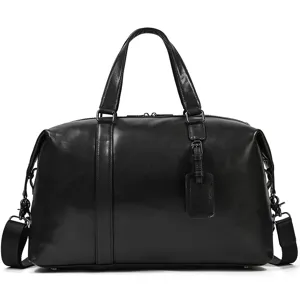 Close-up detail of black genuine leather duffel travel bag showcasing fine stitching and hardware.