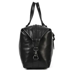 Detailed side view of black leather travel duffel bag showing zipper and metal hardware.