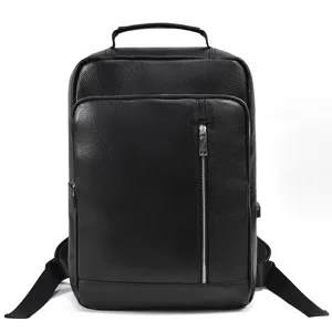 Men's black genuine cowhide business laptop backpack with USB charging port and zipper detail.