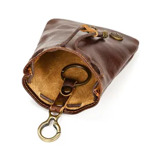 Retro handmade vegetable-tanned leather coin purse, mini drawstring bag with key ring inside.