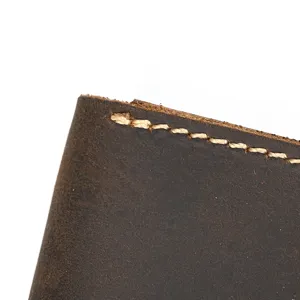 Vintage crazy horse leather watch box detail close up texture and sturdy handmade stitching design.