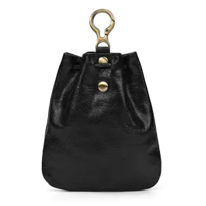 Detail close-up of retro handmade black leather mini coin purse with brass metal snap hook.