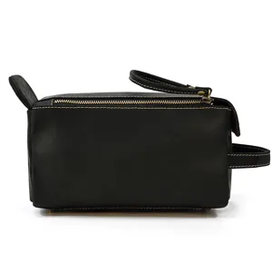 Detail view of the black genuine leather vintage travel toiletry bag cosmetic makeup organizer.