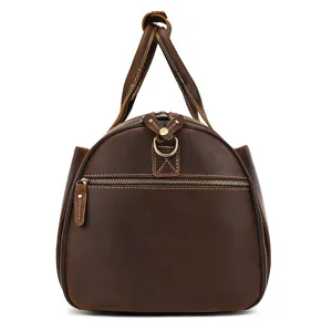 Vintage genuine leather travel duffel bag side detail, brown retro leather luggage handbag.