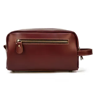 Leather toiletry bag detail, front zipper pocket design, durable travel makeup pouch storage.