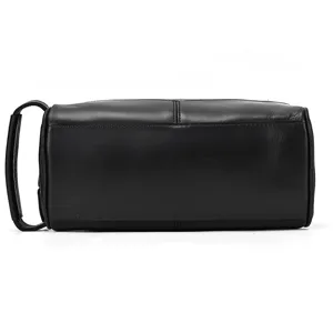 Premium black genuine leather toiletry bag for men, spacious travel wash organizer with handle.