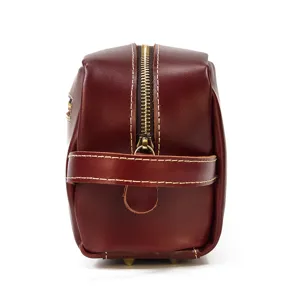 Genuine leather toiletry bag detail, vintage dark brown wash bag with metal zipper.