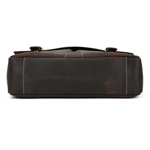 Detail view of genuine crazy horse leather men briefcase bottom, dark brown vintage laptop bag.