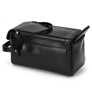 Vintage black genuine leather toiletry bag, travel wash bag and cosmetic clutch for men and women.