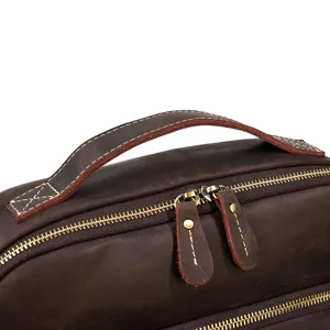 Genuine crazy horse leather backpack top handle and premium metal zipper detail view