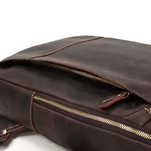 Vintage crazy horse leather backpack detail, brown cowhide texture and metal zipper
