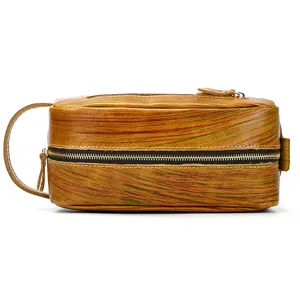 Detail view of retro genuine leather toiletry bag zipper closure side handle close-up