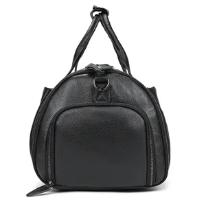 Black leather travel bag and luggage duffel with double handles and front pocket detail.