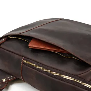Close-up detail of vintage crazy horse leather backpack with durable metal zipper and fine stitching.