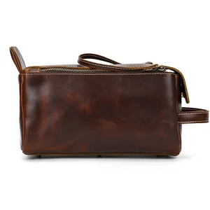 Detail view of genuine leather retro wash bag showing fine texture and durable zipper design.