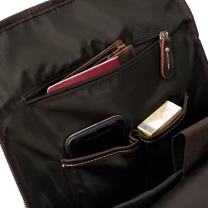 Detailed view of genuine crazy horse leather vintage backpack interior with organized storage pockets.