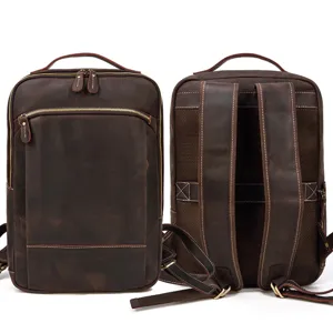 Detail view of the vintage genuine leather backpack showing front and back texture and sturdy zippers.