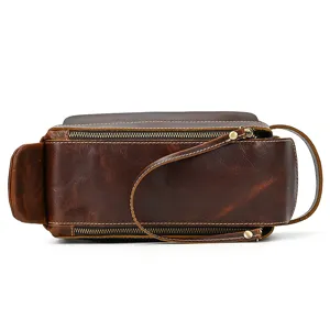 Detail view of vintage genuine leather toiletry bag, crazy horse leather clutch for travel.