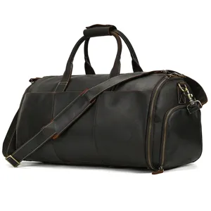 Premium dark brown leather travel duffel bag, spacious weekend luggage with shoulder strap.
