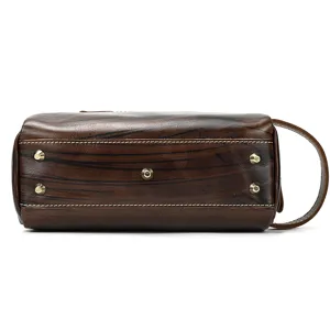 Genuine leather toiletry bag bottom detail, retro brown cosmetic pouch with metal feet.
