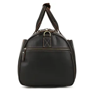 Genuine leather vintage travel duffel bag with durable handles, metal hardware and spacious design.