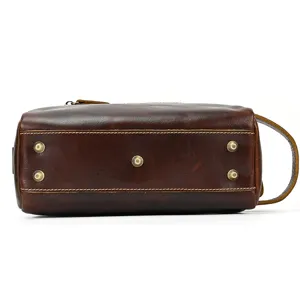 Genuine leather toiletry bag bottom detail view, retro waterproof travel cosmetic storage pouch.