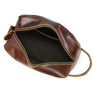 Detailed interior view of retro genuine leather toiletry bag with zipper closure and handle.