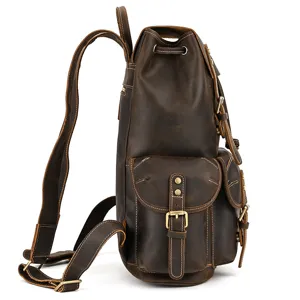 Side view detail of vintage brown crazy horse leather backpack with multi pockets and metal buckles.