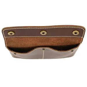 Vintage crazy horse leather watch storage pouch detail showing snap buttons and compartments.
