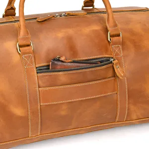 Close-up detail of vintage crazy horse leather travel duffel bag with heavy-duty zipper.