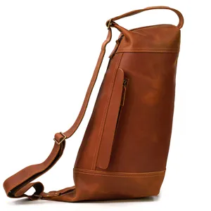 Detailed side view of vintage crazy horse leather men sling bag, brown cowhide crossbody backpack.