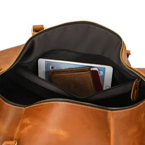 Genuine leather vintage travel duffel bag interior detail showing large capacity and pocket.