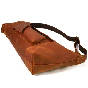 Detailed view of vintage crazy horse leather chest bag, premium cowhide crossbody bag texture.