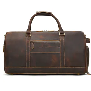 Close-up of vintage genuine leather travel duffel bag with sturdy handles and metal zipper.