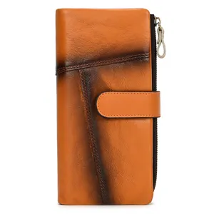 Closeup detail of the vintage burnished cowhide long wallet showing exquisite texture and stitching.