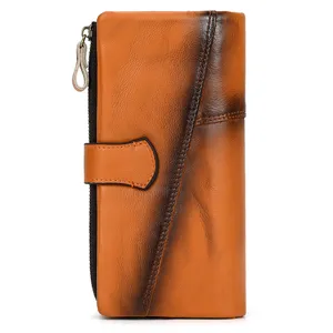 Vintage genuine leather long wallet detail showing the exquisite distressed rubbed-color craft.