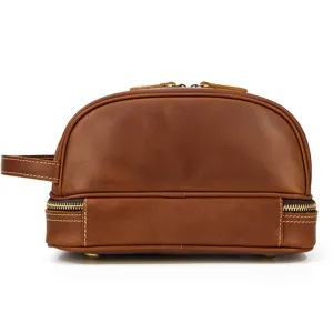 Detail view of vintage crazy horse leather toiletry bag, double layer design, brown.