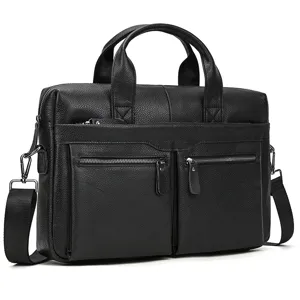 Detail view of black leather business briefcase featuring dual zippers and adjustable shoulder strap.