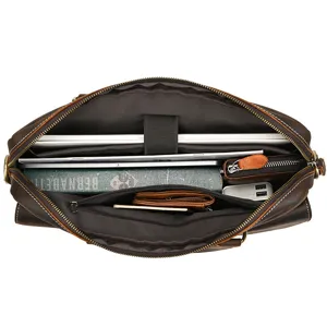 Detail top view of leather business briefcase interior showing laptop compartment.