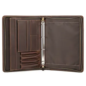 Leather A4 document folder detail view, business organizer with ring binder and multiple card slots.