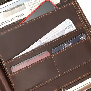 Detailed view of genuine leather business portfolio interior with multiple card and document slots.