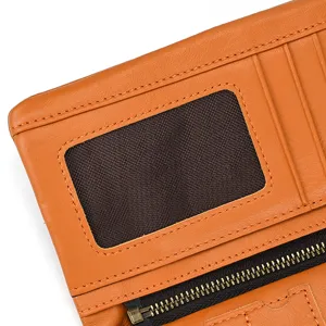 Close-up detail of vintage genuine leather long wallet showing card slots and ID window.