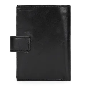 Close-up detail of a black leather wallet showing fine texture and snap button closure.