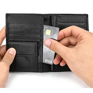 Black genuine leather trifold wallet detail showing card slots, coin pocket and compact structure.
