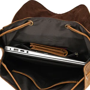 Detailed view of genuine leather vintage backpack interior, showing spacious main compartment.
