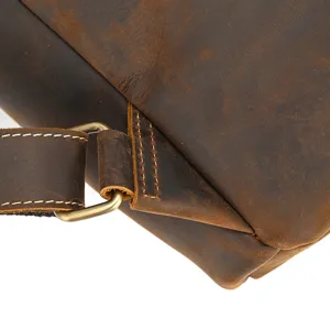 Close-up detail of vintage crazy horse leather backpack strap buckle and premium texture.