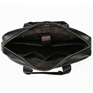 Detailed top view of black genuine leather business laptop briefcase interior compartments.