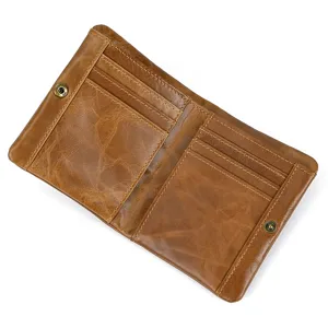 Detail view of retro genuine leather men's wallet with multiple card slots and secure snap button.