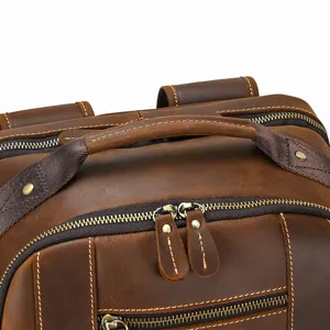 Leather backpack detail showing premium crazy horse leather texture, sturdy zippers and fine stitching.